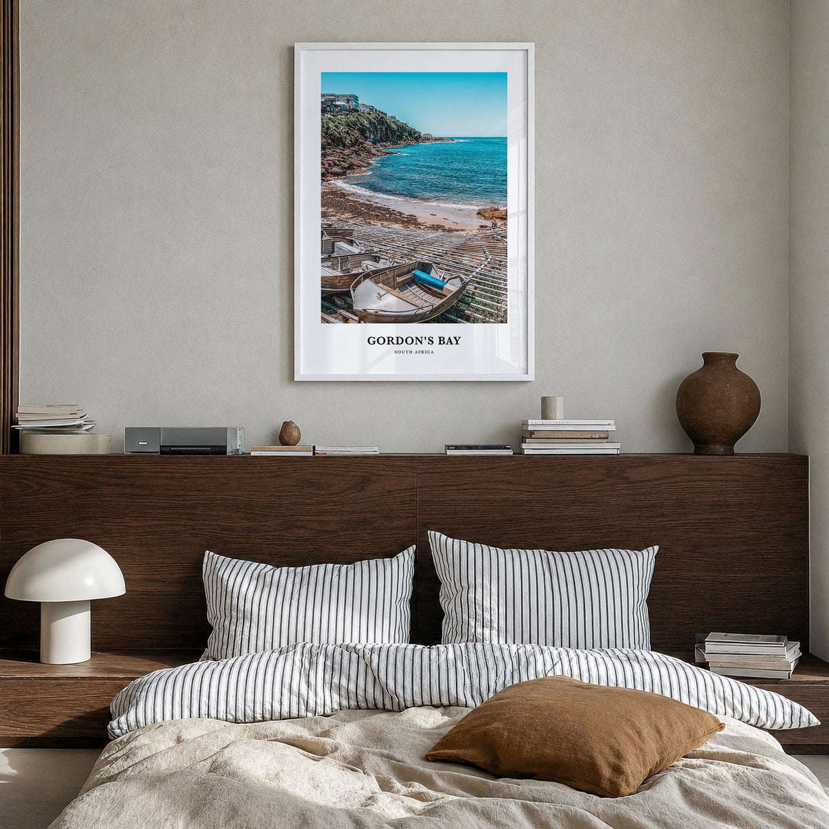 Gordon's Bay colorful classic poster of South Africa – vertical wall art in white wood frame, hanging on wall