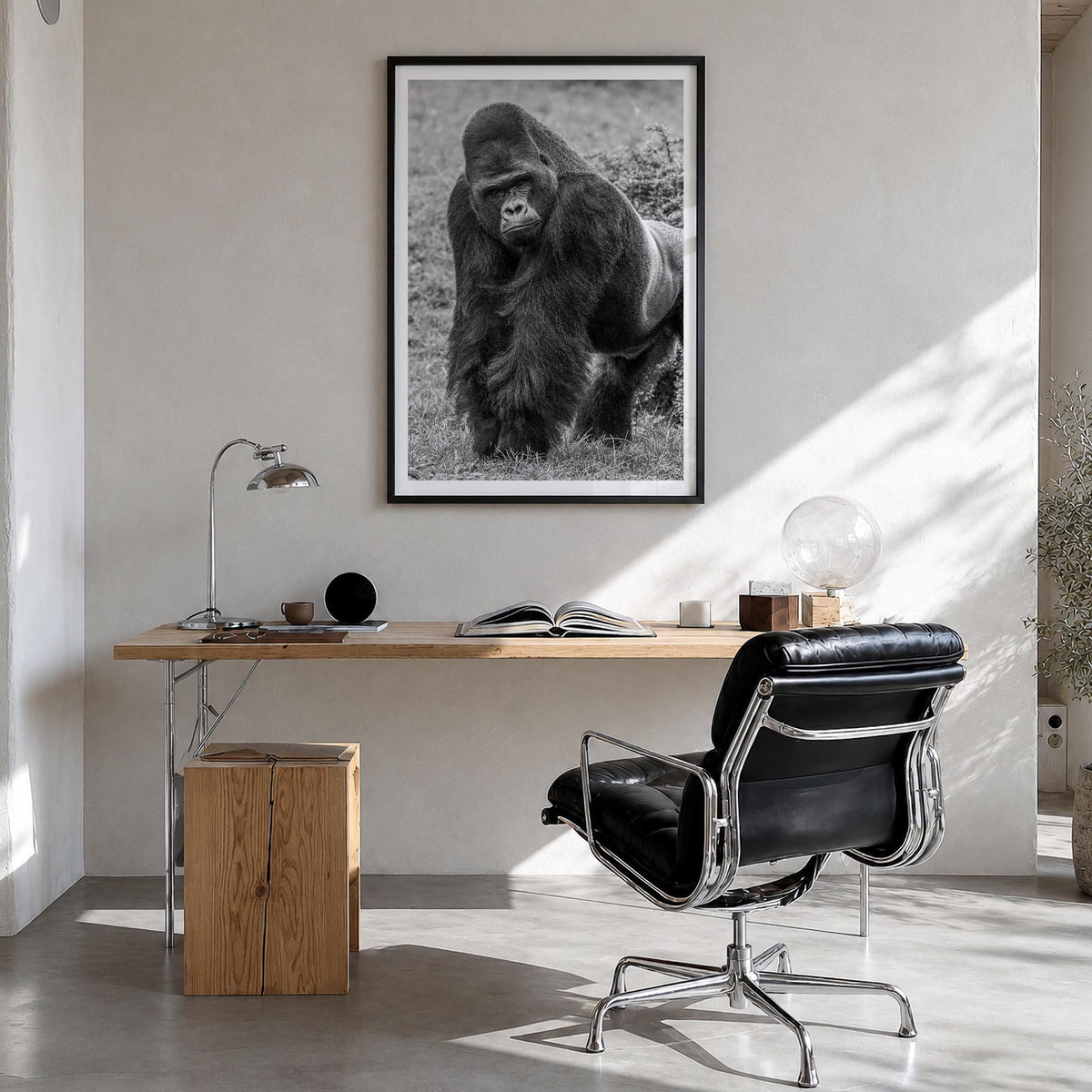Gorilla black & white photo poster – vertical wall art in black wood frame with white border, hanging on wall