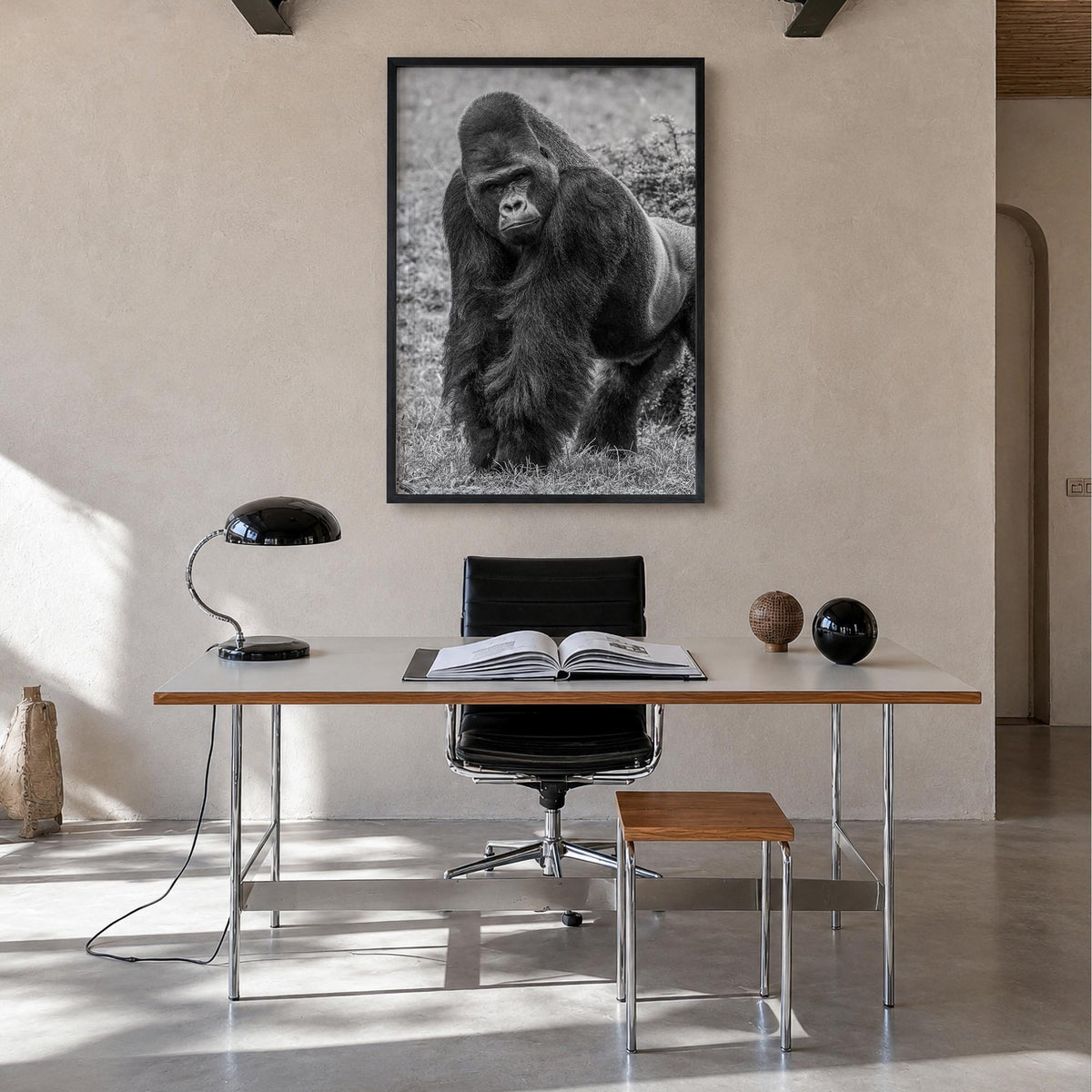 Gorilla black & white photo poster – vertical wall art in black wood frame, hanging on wall