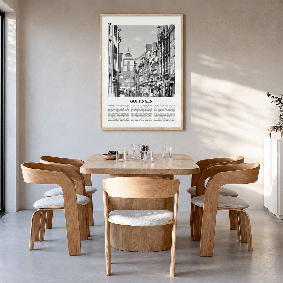 Göttingen Newspaper Poster in a natural wood frame, hanging in a dining room