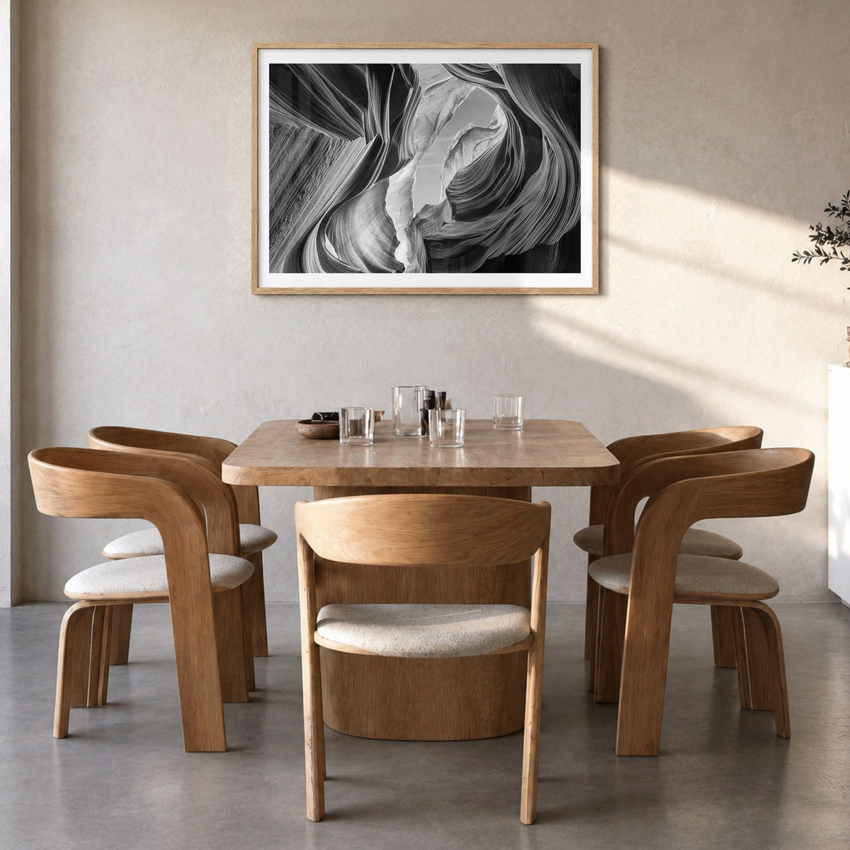 Grand Canyon Photo Poster in a natural wood frame, hanging in a dining room, white border
