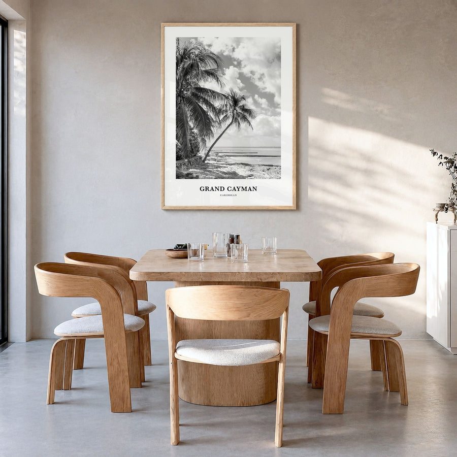Grand Cayman Classic Poster in a natural wood frame, hanging in a dining room