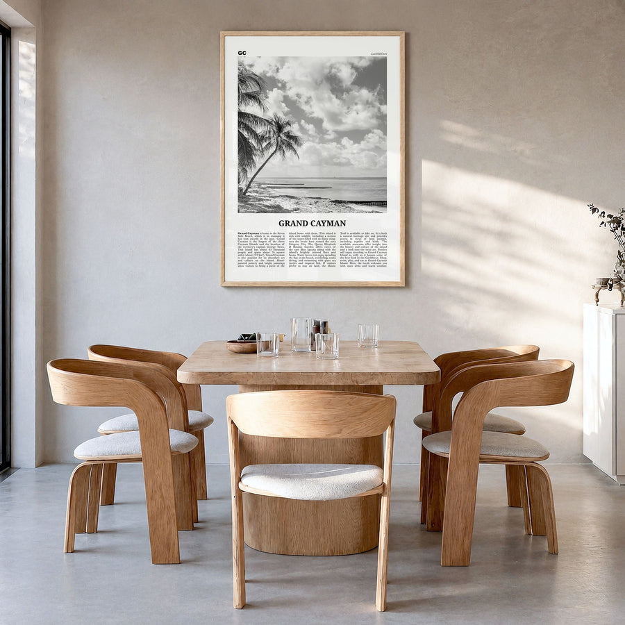 Grand Cayman Newspaper Poster in a natural wood frame, hanging in a dining room