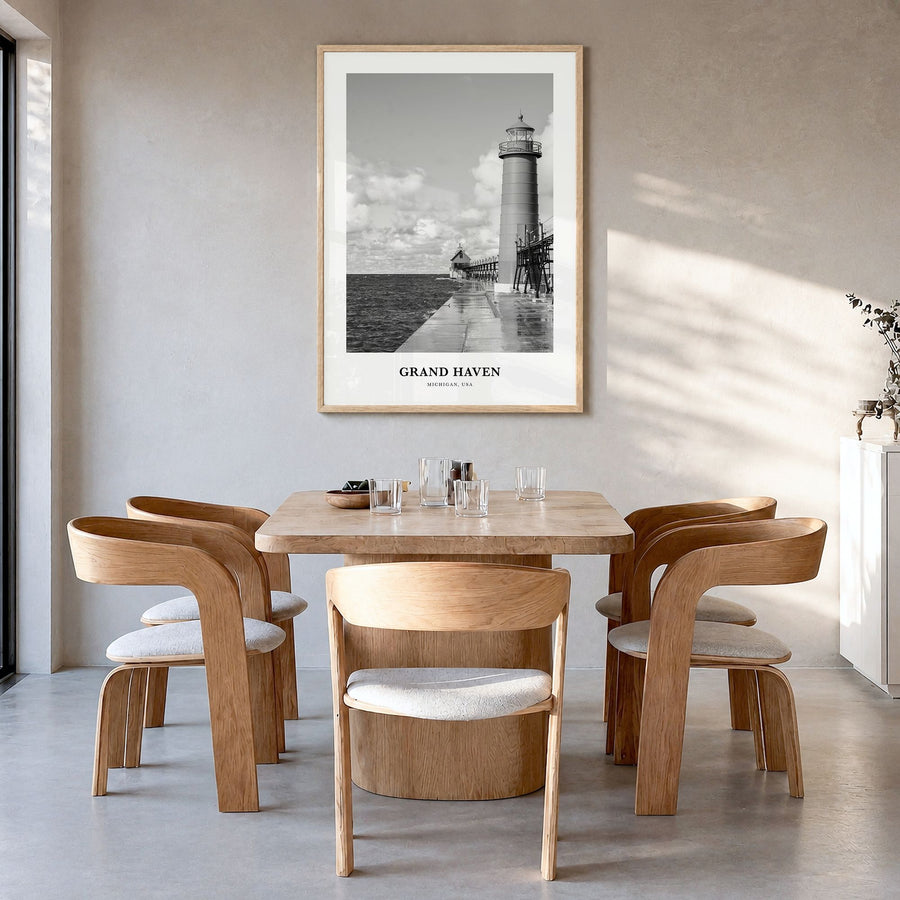 Grand Haven Classic Poster in a natural wood frame, hanging in a dining room