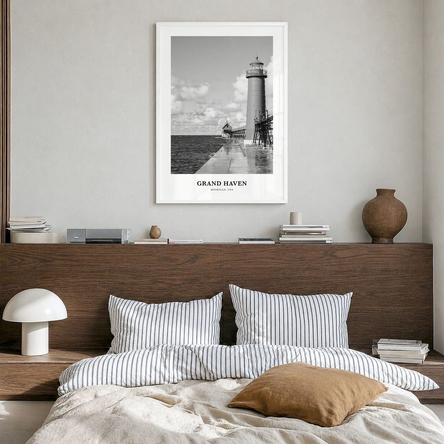 Grand Haven Classic Poster in a white wood frame, hanging in a bedroom