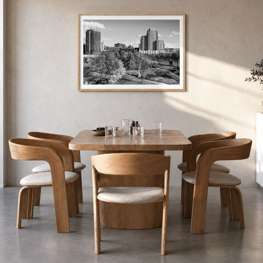 Grand Rapids Photo Poster in a natural wood frame, hanging in a dining room, white border