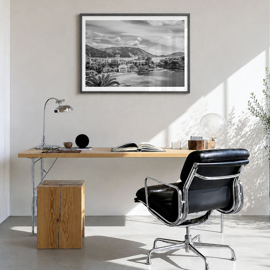 Greece Photo Poster in a black wood frame, hanging in a bright home office, white border