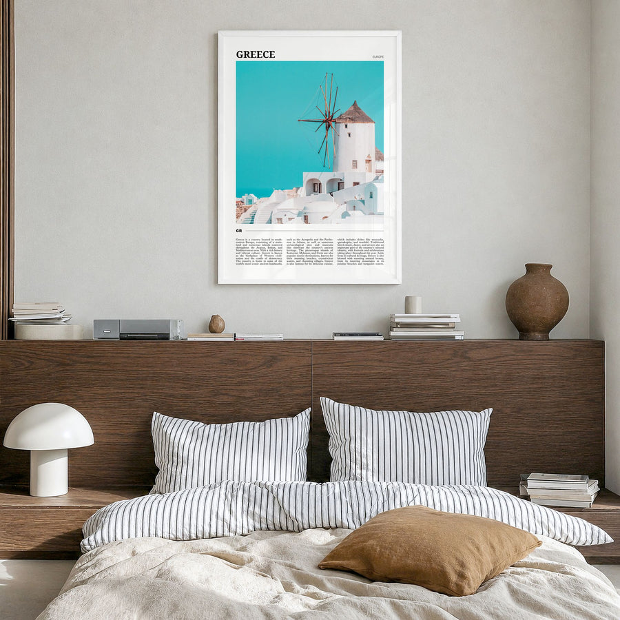 Greece Travel Poster in a white wood frame, hanging in a bedroom