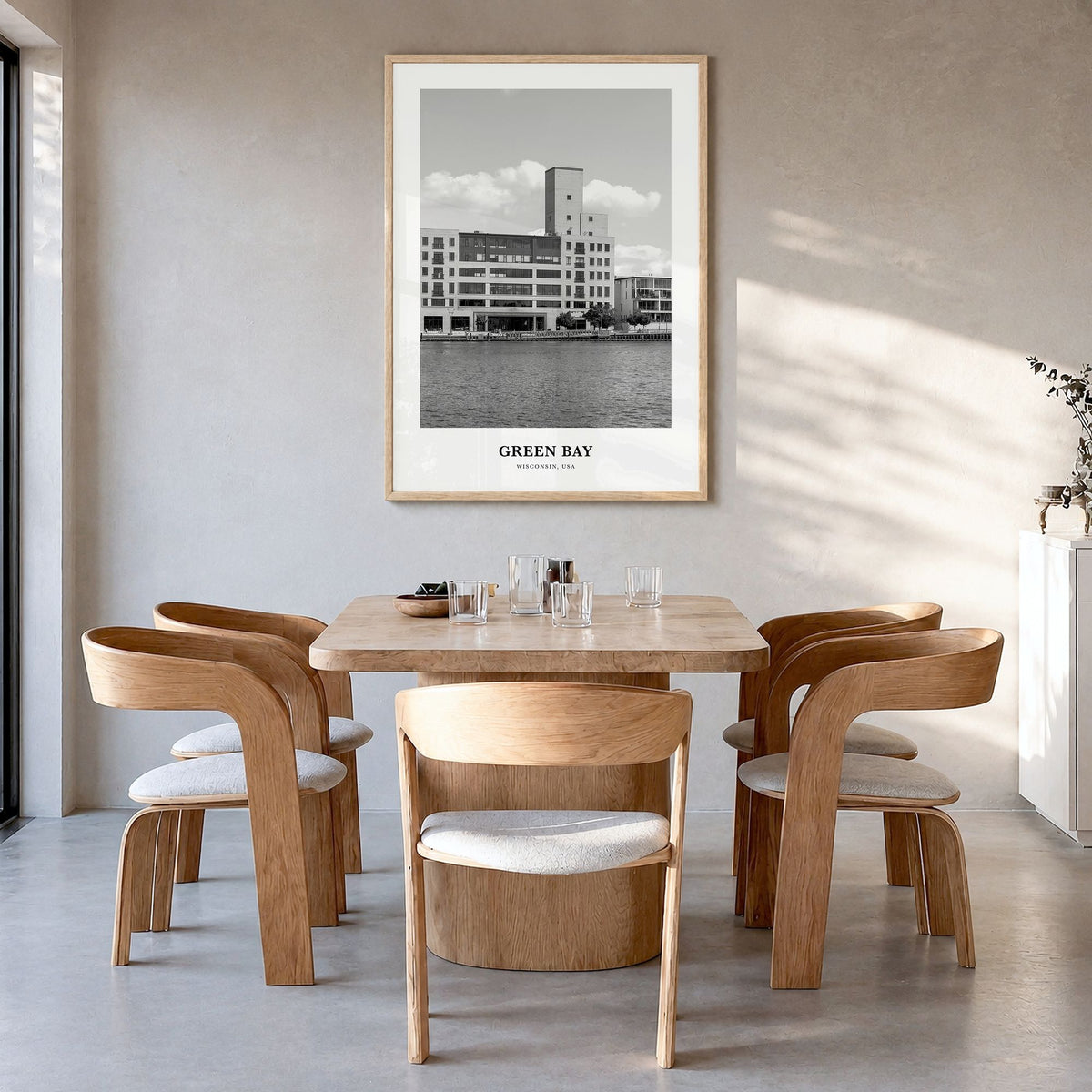 Green Bay Classic Poster in a natural wood frame, hanging in a dining room