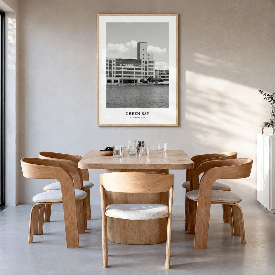Green Bay Classic Poster in a natural wood frame, hanging in a dining room