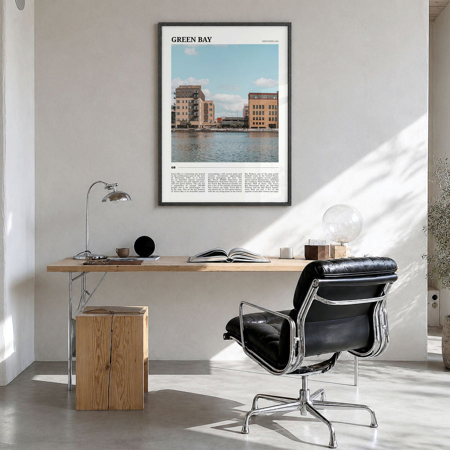 Green Bay Travel Poster in a black wood frame, hanging in a bright home office