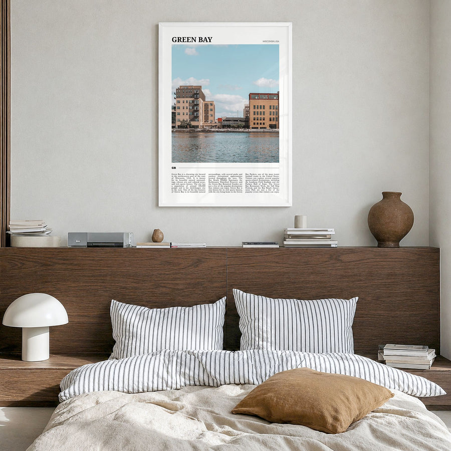 Green Bay Travel Poster in a white wood frame, hanging in a bedroom