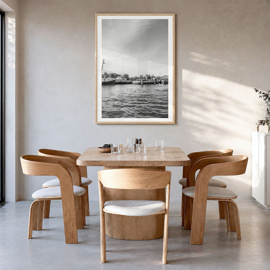 Greenport Photo Poster in a natural wood frame, hanging in a dining room, white border