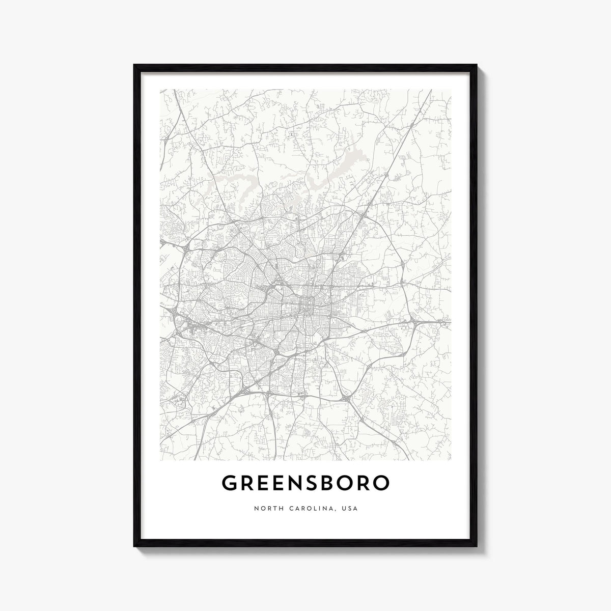 Greensboro black & white map poster of North Carolina, USA – vertical wall art, unframed print shown in interior mockup