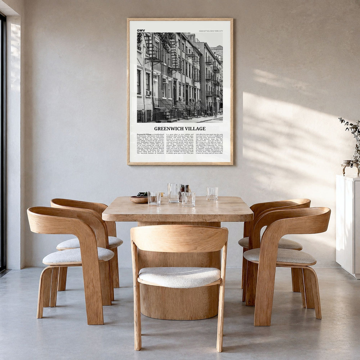 Greenwich Village Newspaper Poster in a natural wood frame, hanging in a dining room