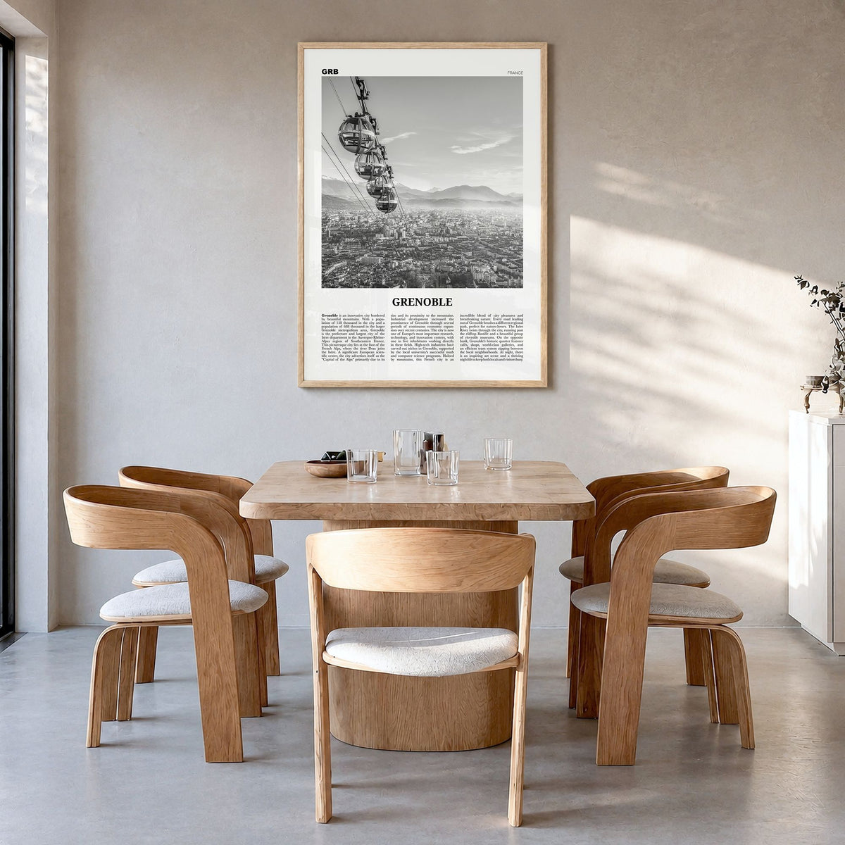 Grenoble Newspaper Poster in a natural wood frame, hanging in a dining room