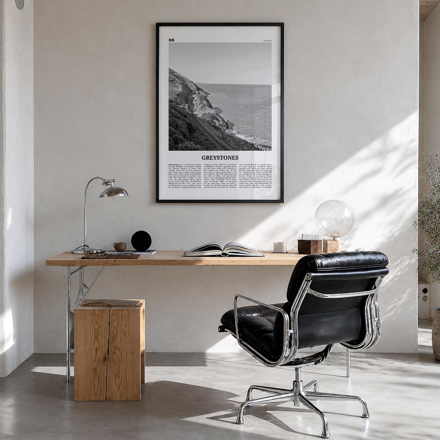 Greystones black & white newspaper poster of Ireland – vertical wall art in black wood frame, hanging on wall