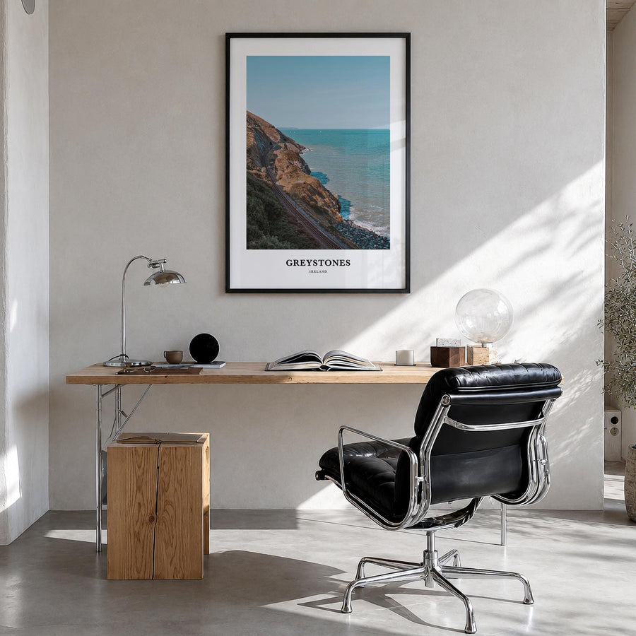 Greystones colorful classic poster of Ireland – vertical wall art in black wood frame, hanging on wall