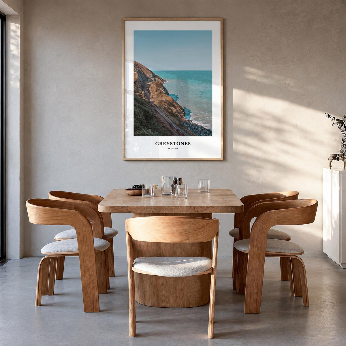 Greystones colorful classic poster of Ireland – vertical wall art in natural wood frame, hanging on wall