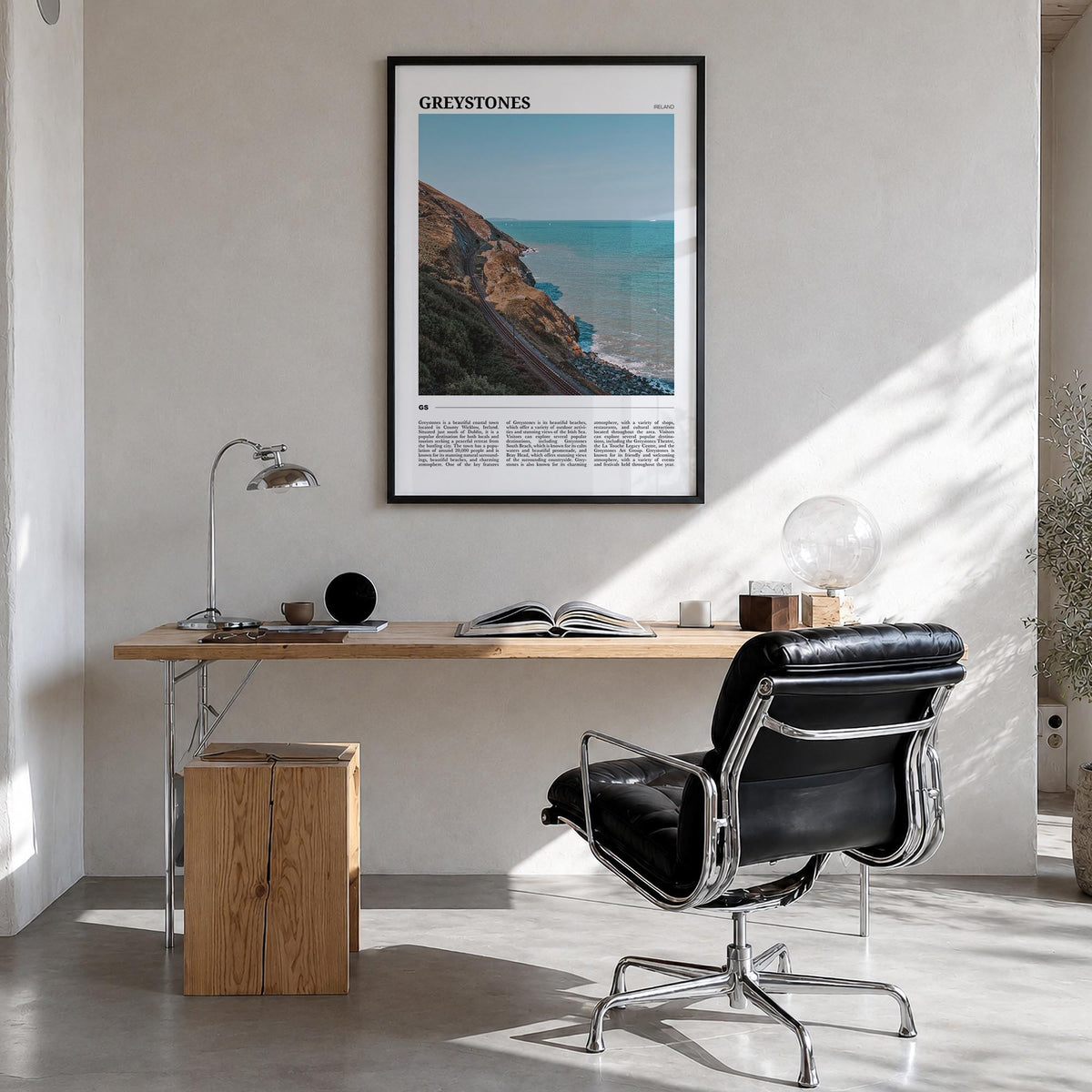 Greystones colorful travel poster of Ireland – vertical wall art in black wood frame, hanging on wall