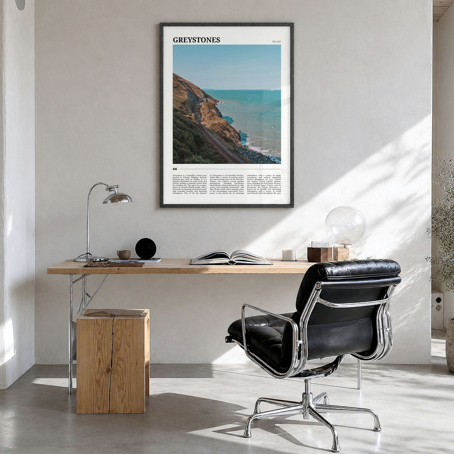 Greystones Travel Poster in a black wood frame, hanging in a bright home office