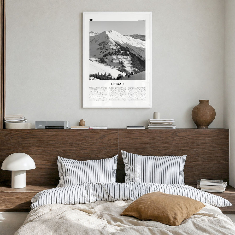 Gstaad Newspaper Poster in a white wood frame, hanging in a bedroom