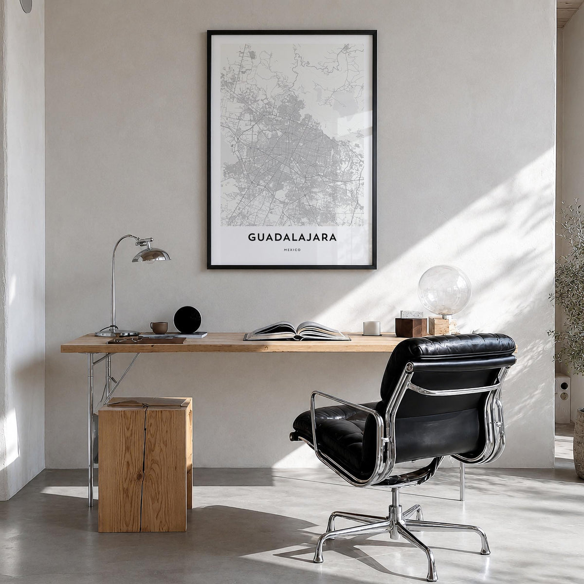 Guadalajara black & white map poster of Mexico – vertical wall art in black wood frame, hanging on wall