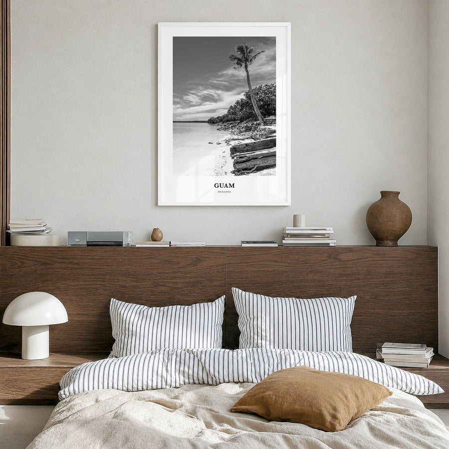 Guam Classic Poster in a white wood frame, hanging in a bedroom
