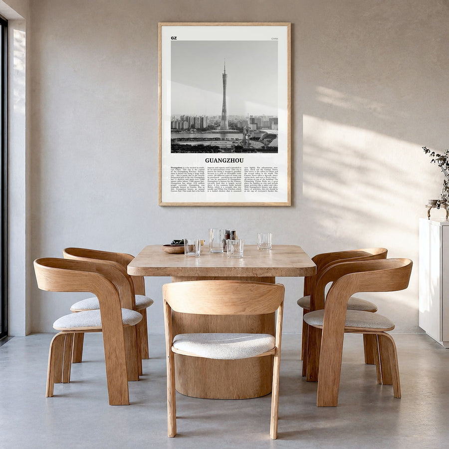 Guangzhou Newspaper Poster in a natural wood frame, hanging in a dining room