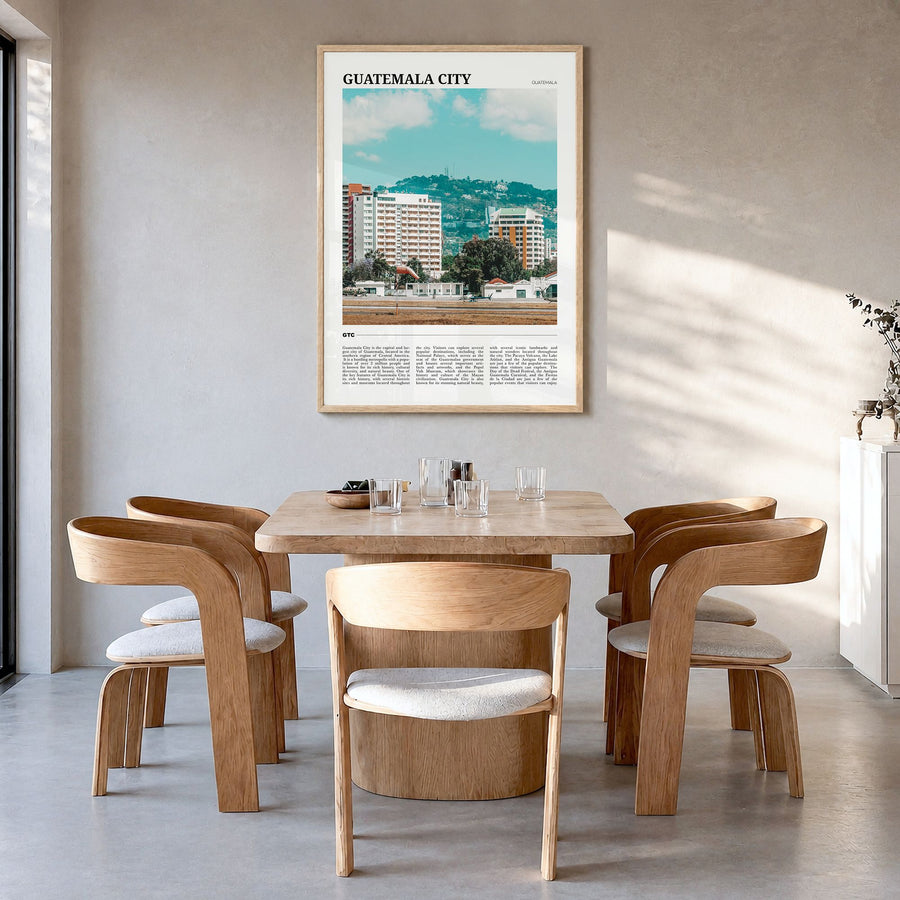 Guatemala City Travel Poster in a natural wood frame, hanging in a dining room