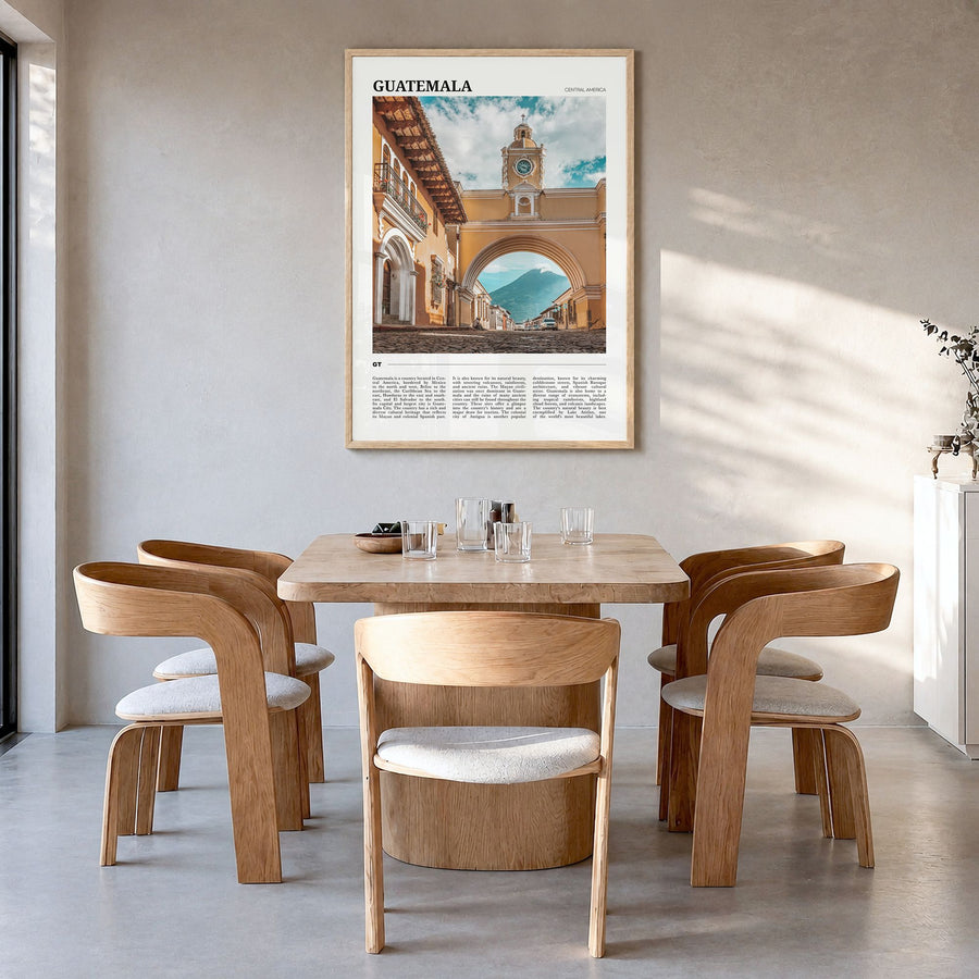 Guatemala Travel Poster in a natural wood frame, hanging in a dining room