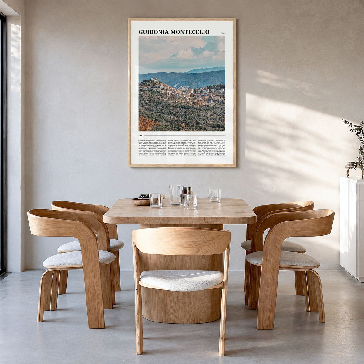 Guidonia Montecelio Travel Poster in a natural wood frame, hanging in a dining room