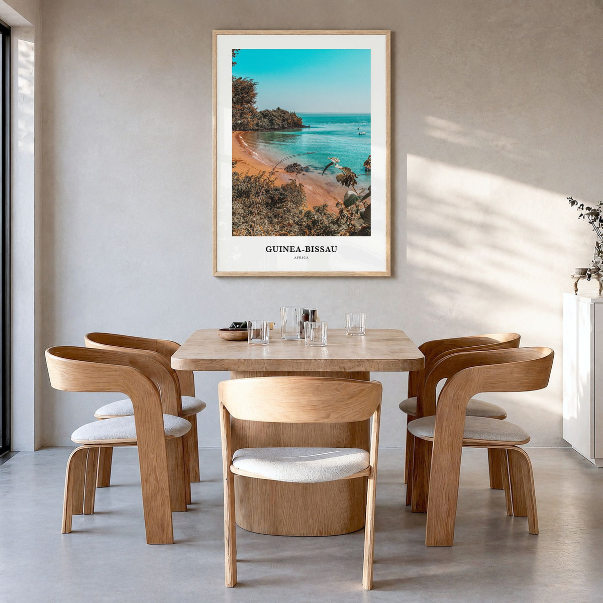 Guinea-Bissau Classic Poster in a natural wood frame, hanging in a dining room