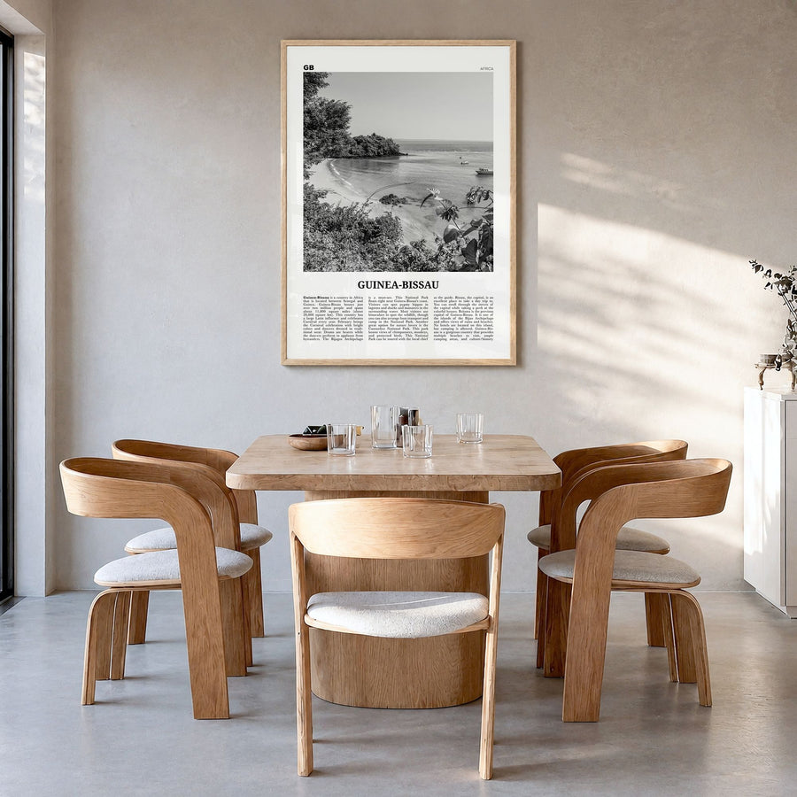 Guinea-Bissau Newspaper Poster in a natural wood frame, hanging in a dining room