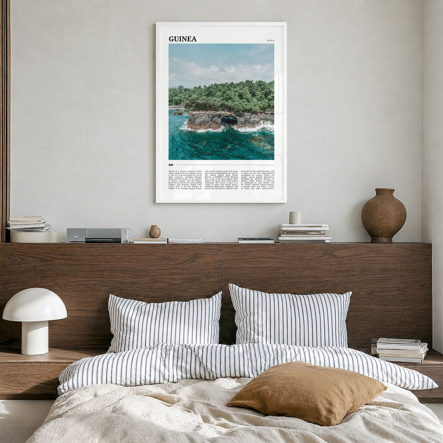 Guinea Travel No 1 Poster in a white wood frame, hanging in a bedroom