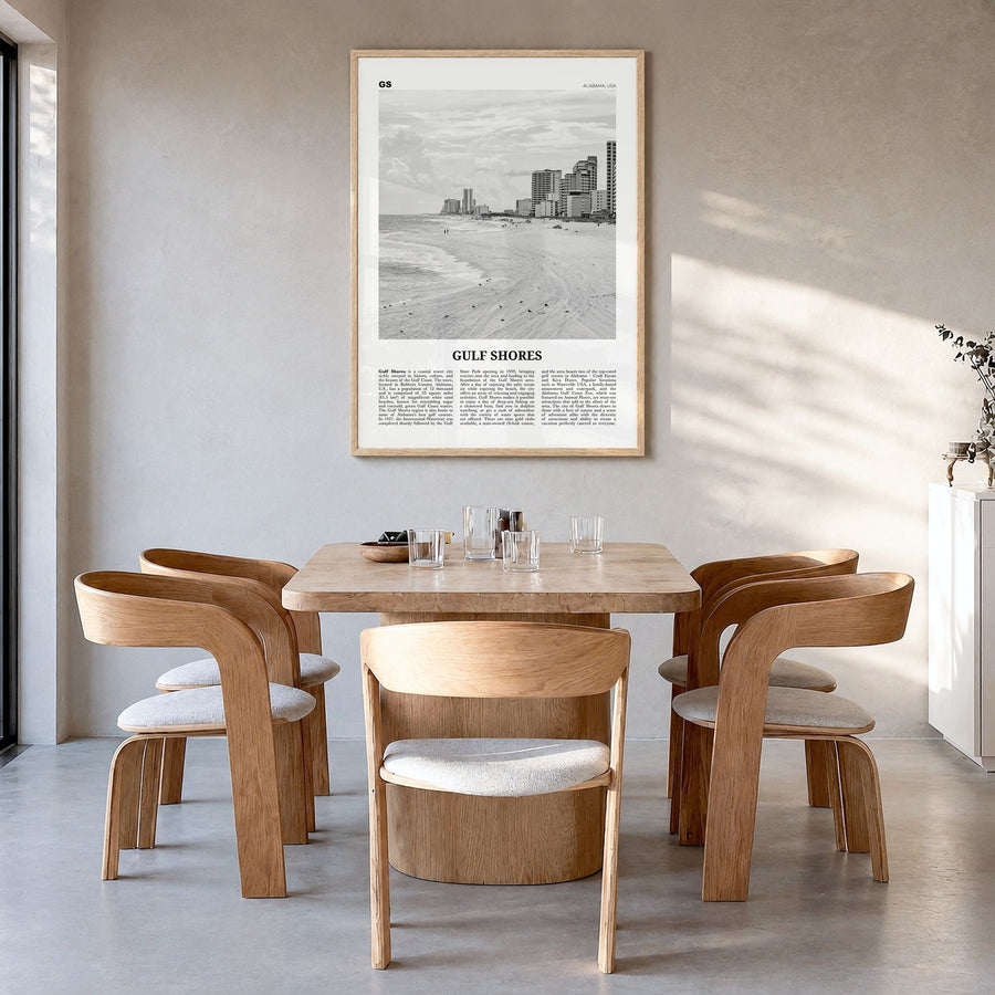 Gulf Shores Newspaper Poster in a natural wood frame, hanging in a dining room
