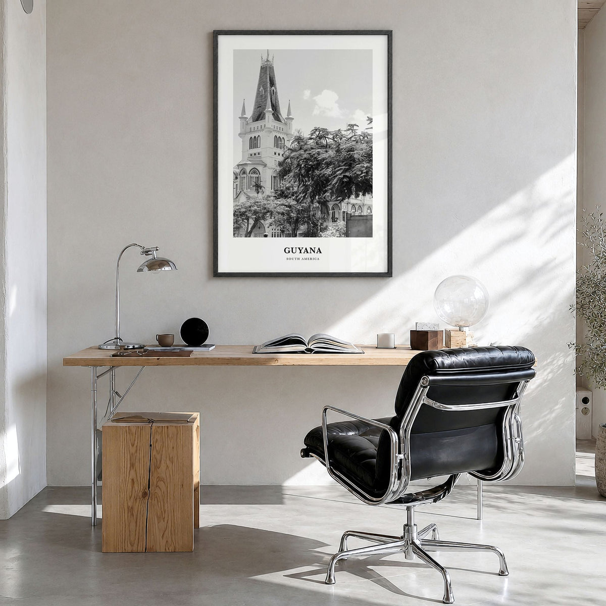 Guyana Classic Poster in a black wood frame, hanging in a bright home office
