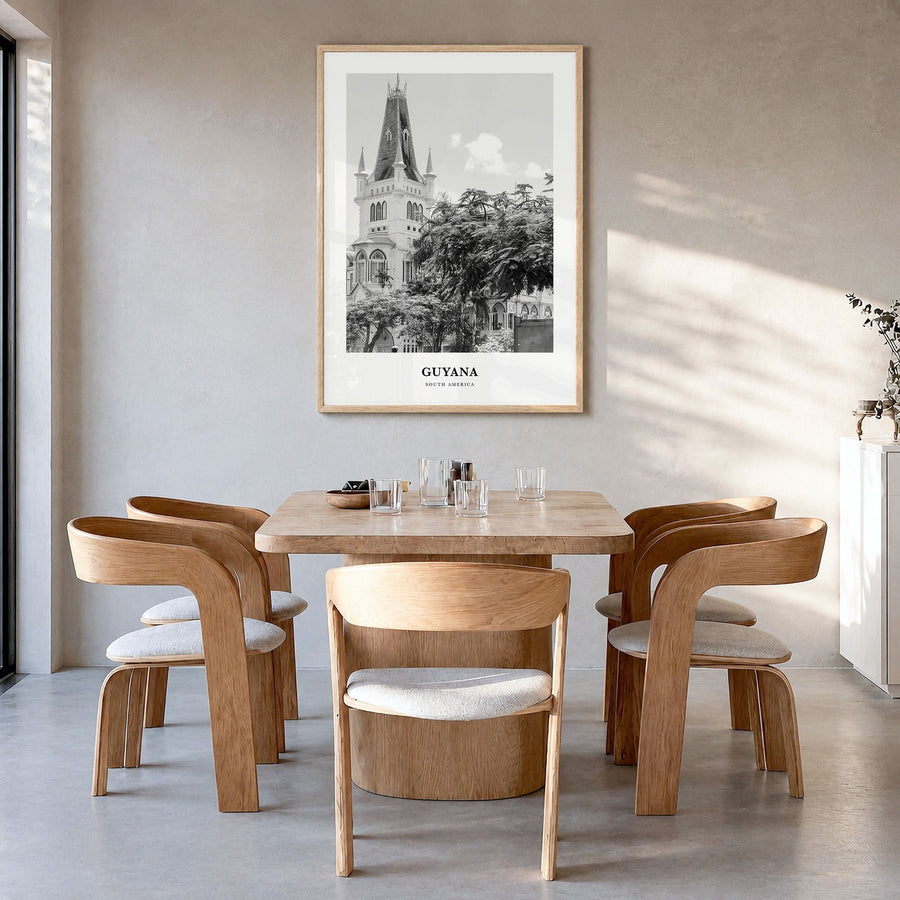 Guyana Classic Poster in a natural wood frame, hanging in a dining room