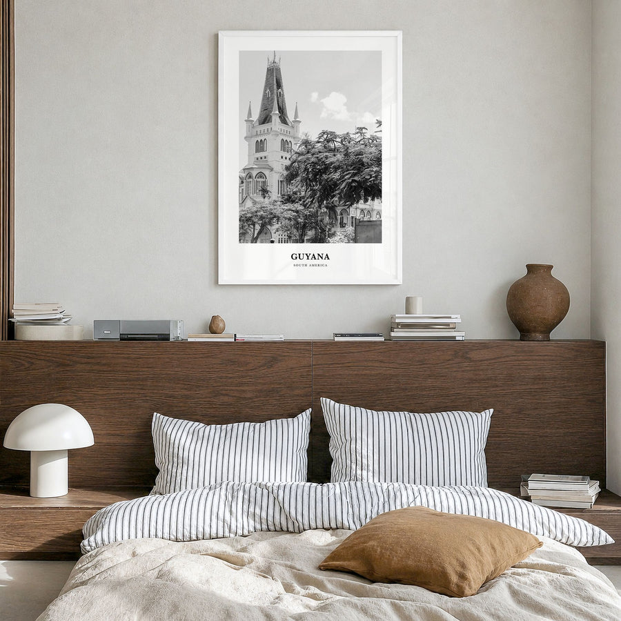 Guyana Classic Poster in a white wood frame, hanging in a bedroom
