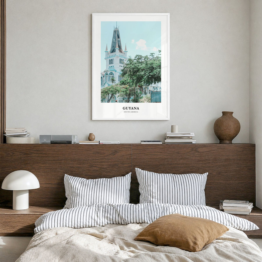 Guyana Classic Poster in a white wood frame, hanging in a bedroom