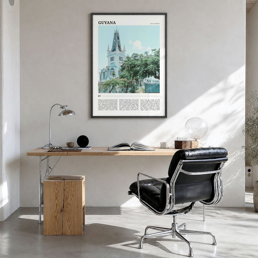 Guyana Travel Poster in a black wood frame, hanging in a bright home office