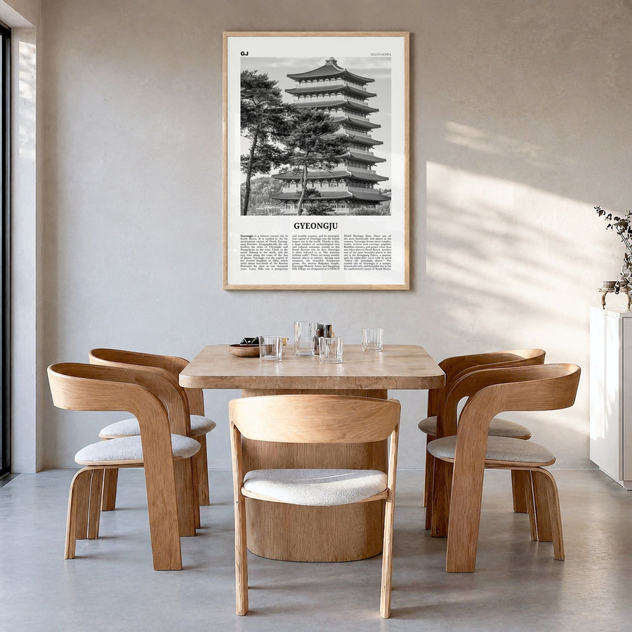 Gyeongju Newspaper Poster in a natural wood frame, hanging in a dining room