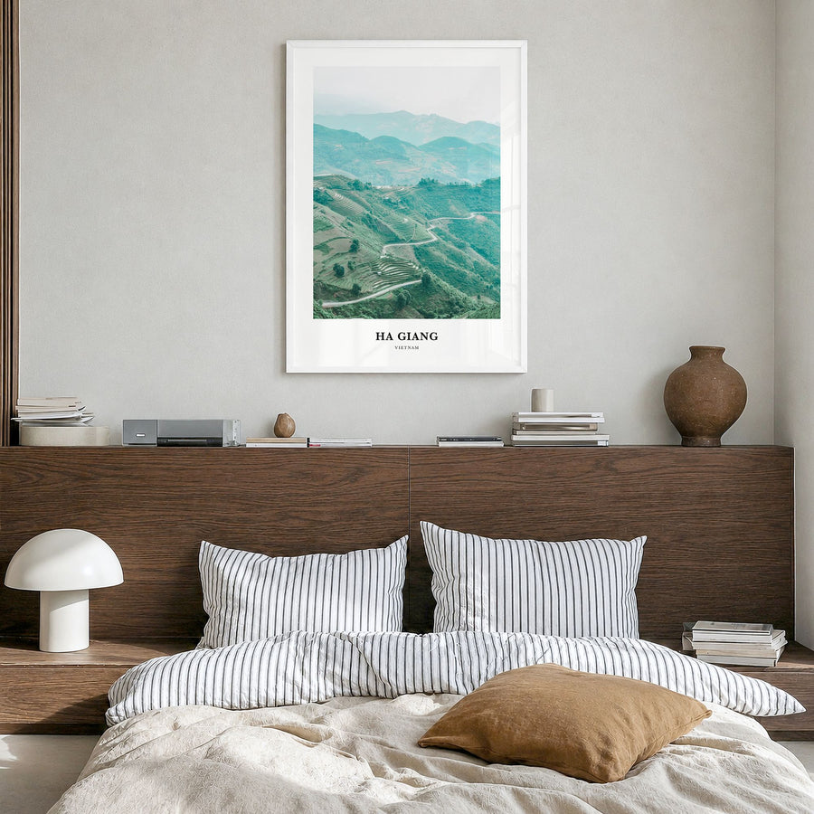 Ha Giang Classic Poster in a white wood frame, hanging in a bedroom