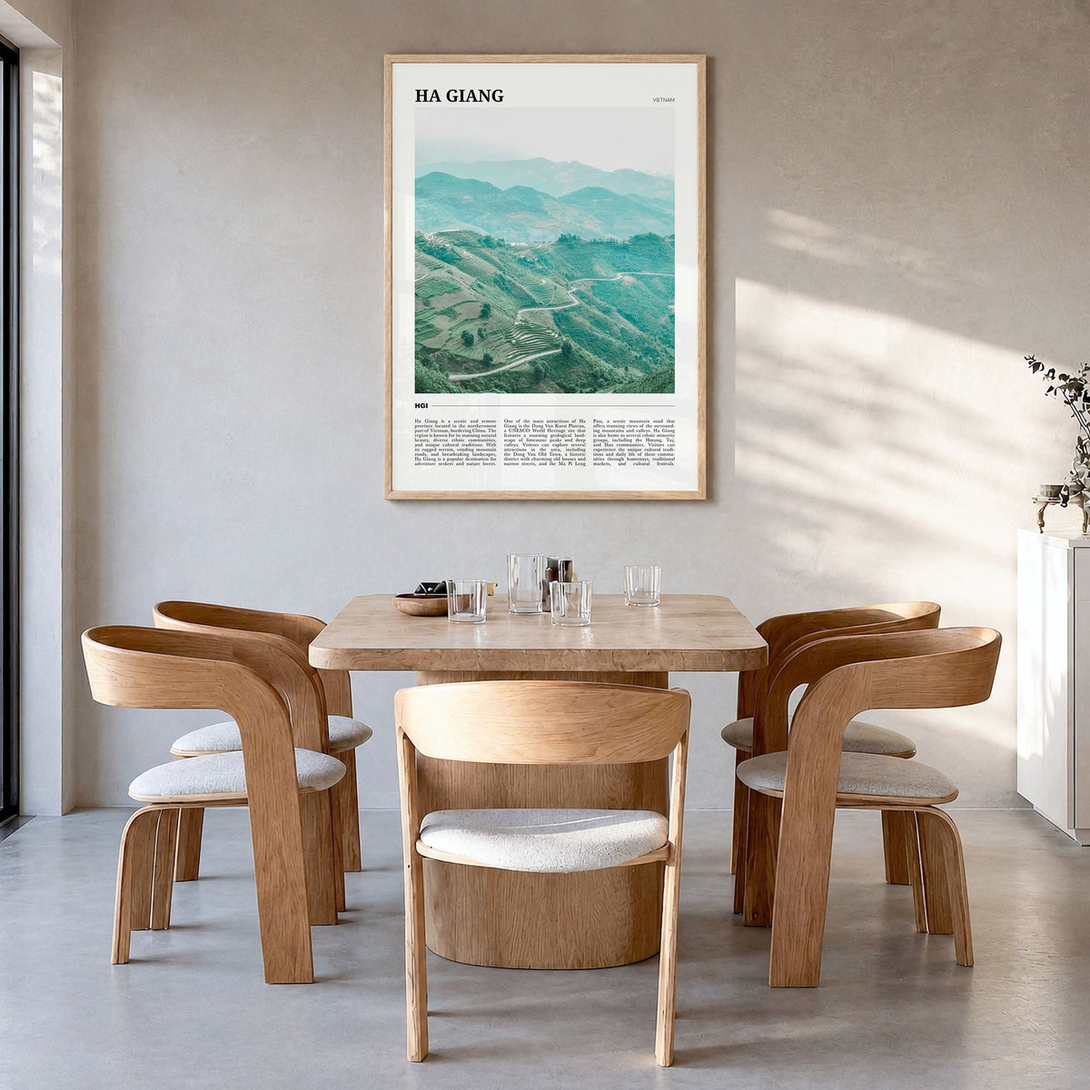 Ha Giang Travel Poster in a natural wood frame, hanging in a dining room