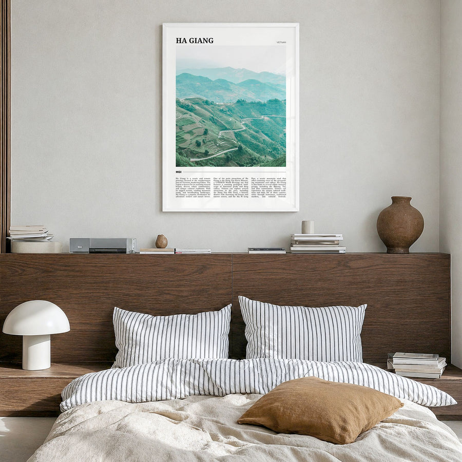 Ha Giang Travel Poster in a white wood frame, hanging in a bedroom