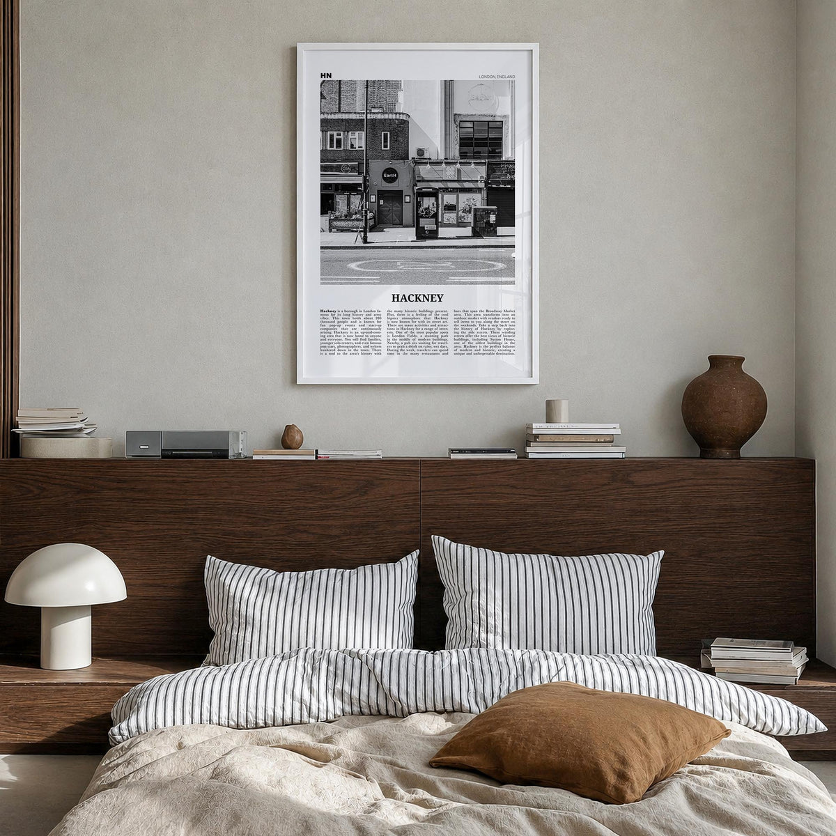 Hackney black & white newspaper poster of London, England – vertical wall art in white wood frame, hanging on wall