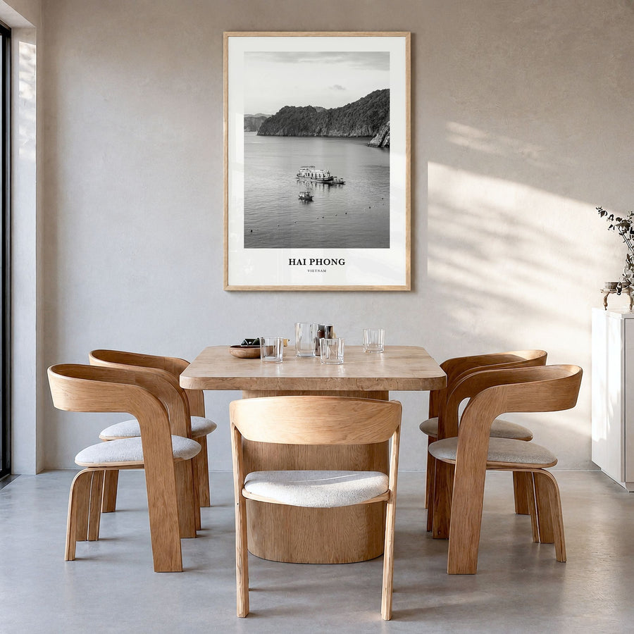 Hai Phong Classic Poster in a natural wood frame, hanging in a dining room