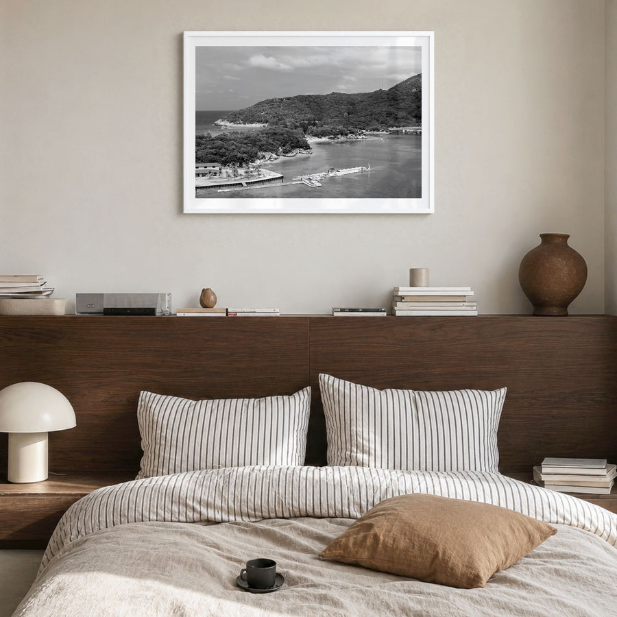 Haiti Photo Poster in a white wood frame, hanging in a bedroom, white border