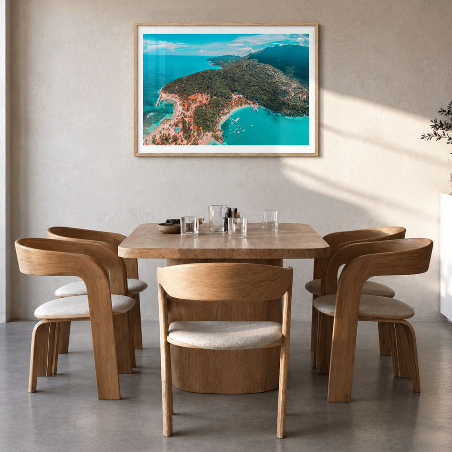 Haiti Photo Poster in a natural wood frame, hanging in a dining room, white border