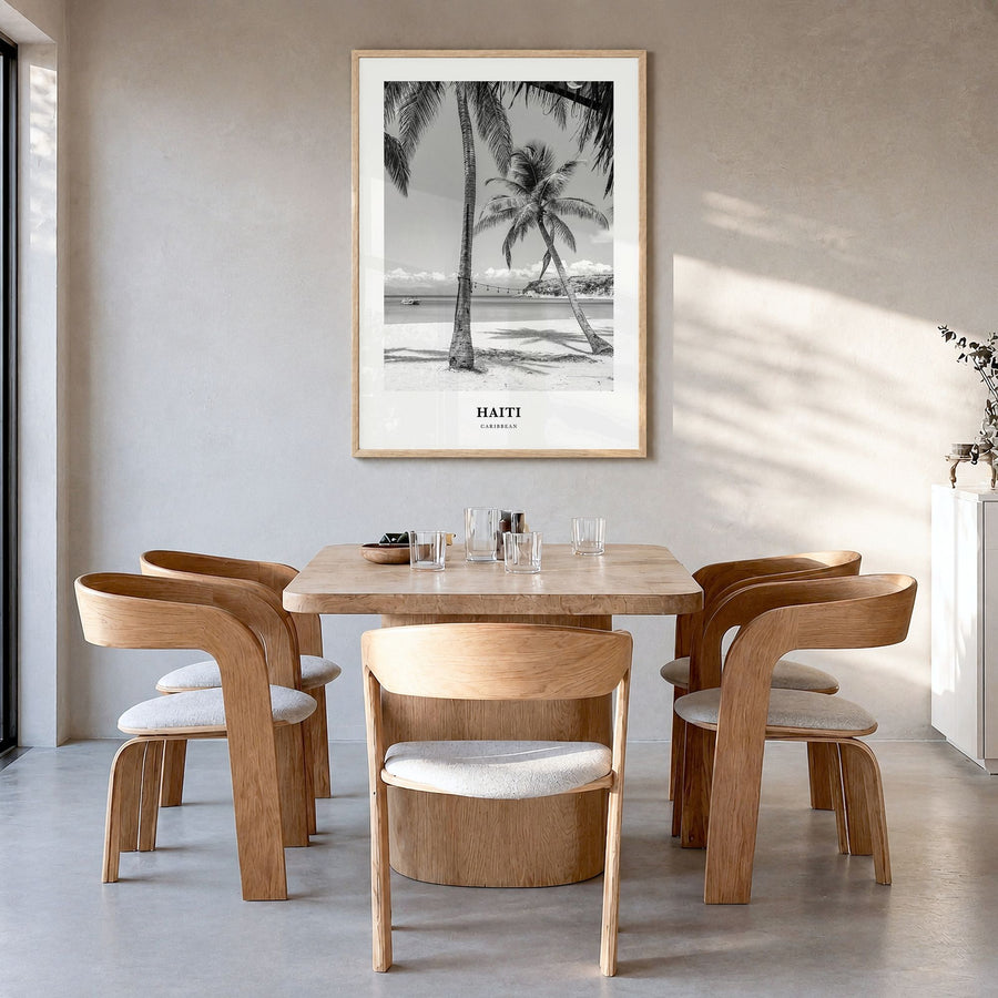 Haiti Classic No 1 Poster in a natural wood frame, hanging in a dining room
